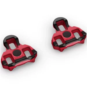 A pair of red and black Garmin Rally RK Cleats featuring a 6 Degree Float, on a white background.